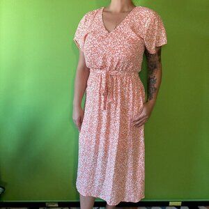 Soft flowy orange floral midi dress with fitted waist ,short sleeve, pockets